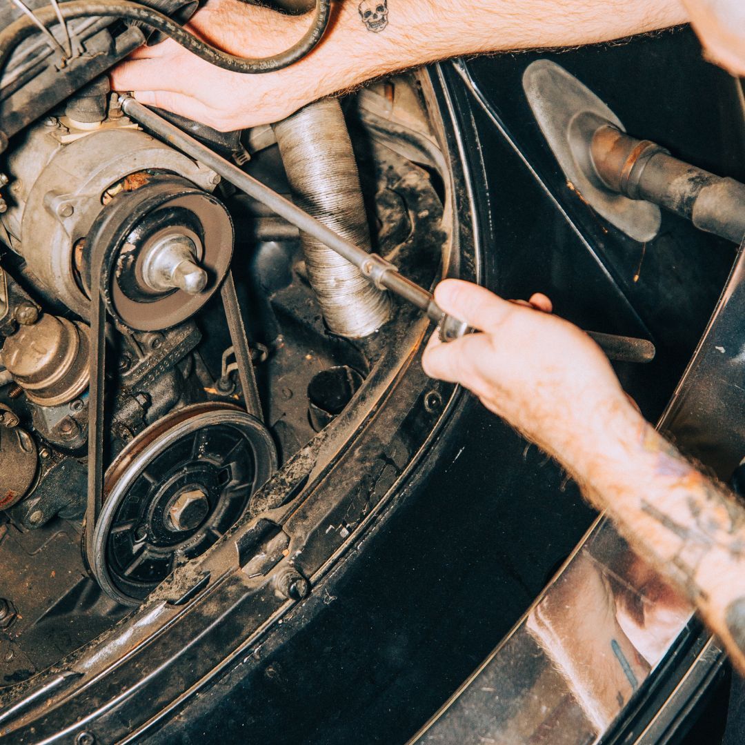 mechanic working on an old car