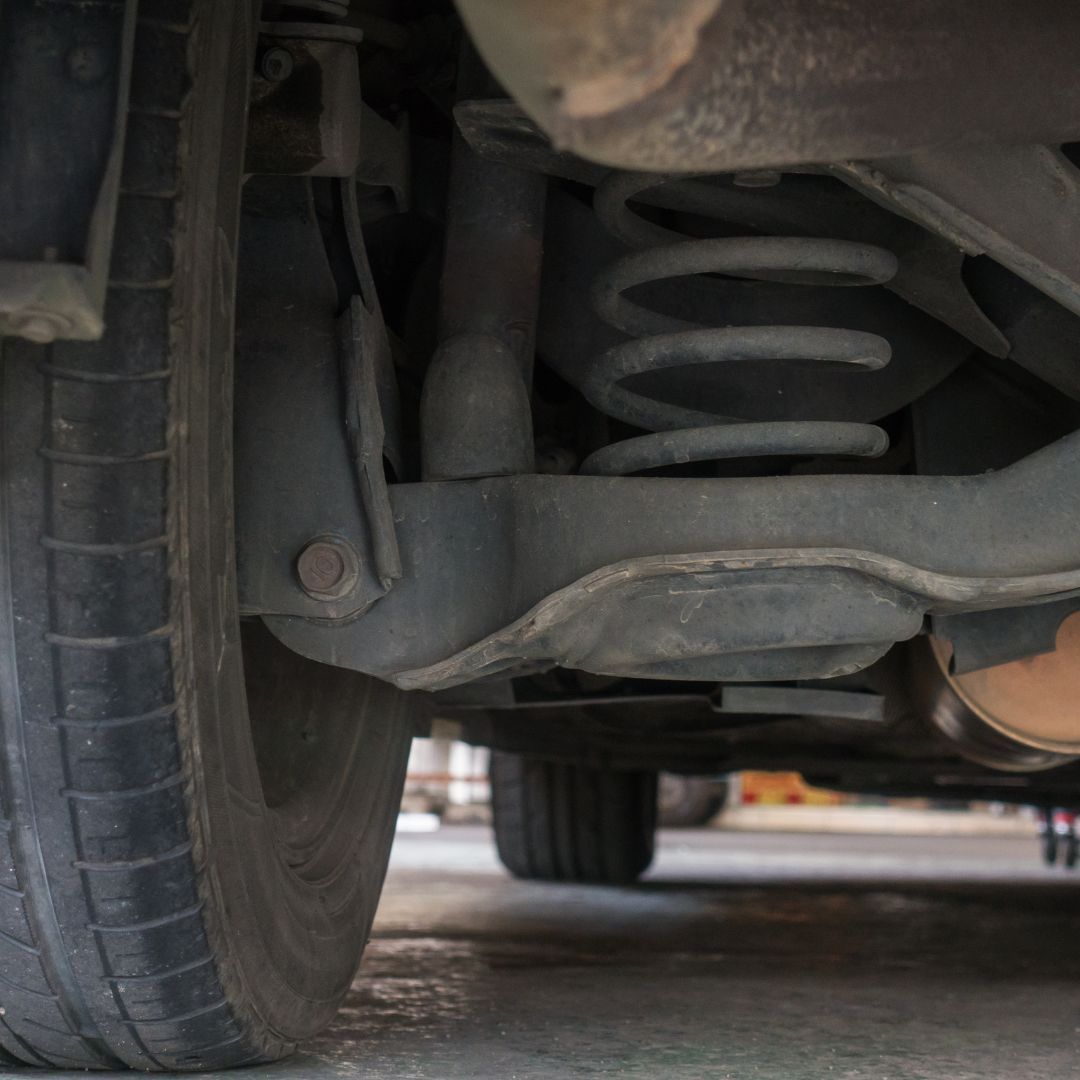 underneath a car being repaired at mechanic